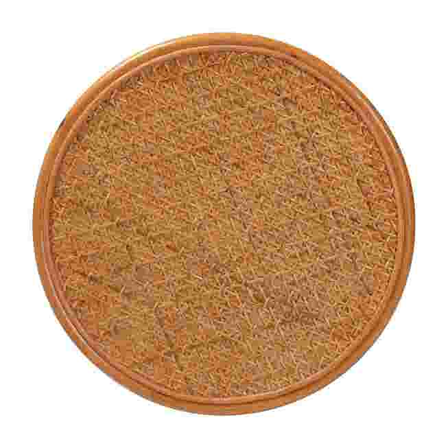 Close-up of the round top surface of the rattan end table.