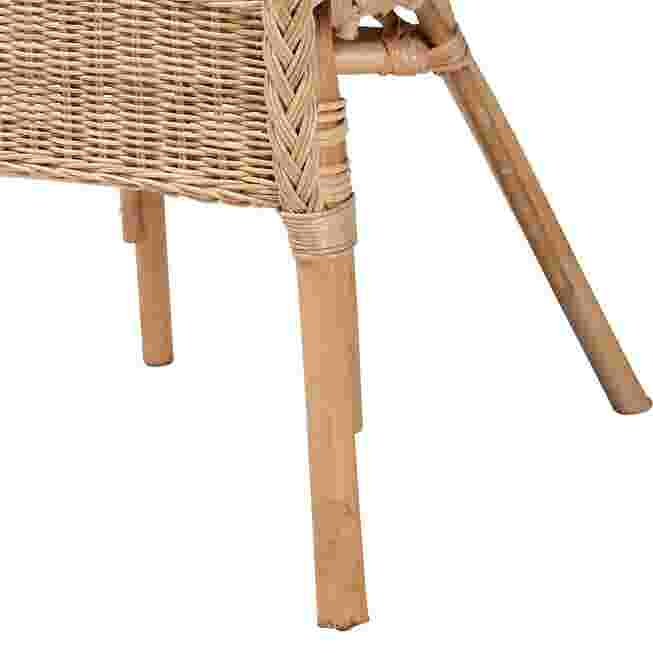 Close-up of the leg and woven frame of a natural rattan chair