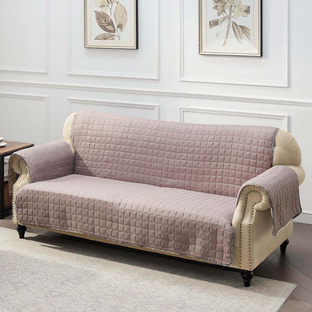 Soft pink/taupe quilted furniture protector on sofa