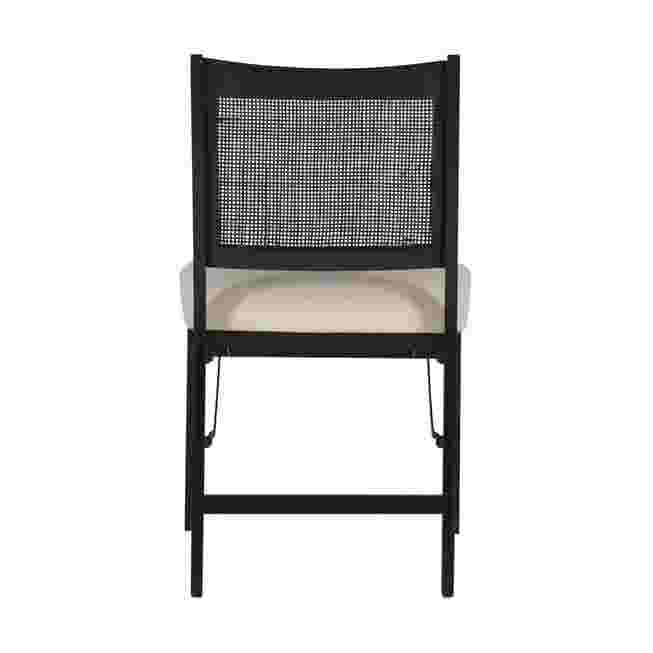 Back view of a black folding chair with a woven back and a light-colored seat cushion.