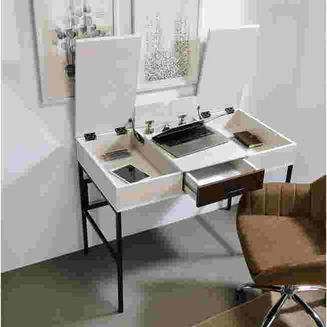 White writing desk with black metal frame, open drawer, and hinged panels in a room setting