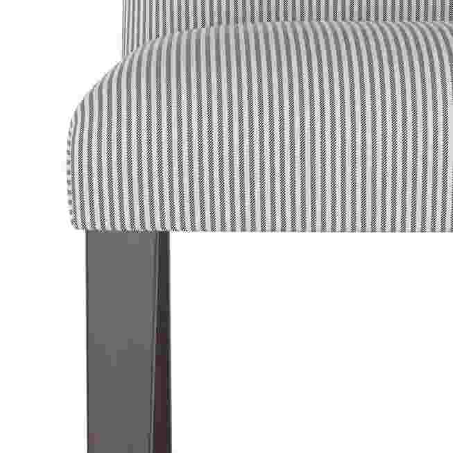 Close-up of the striped fabric on the seat of the dining chair