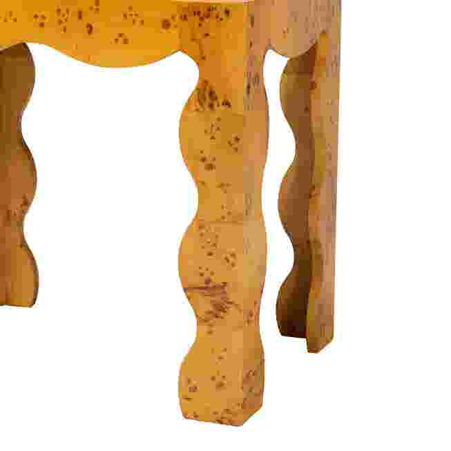 Close-up of sculpted burl wood leg