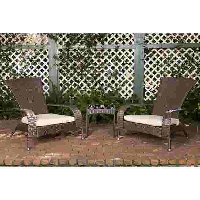 Two dark wicker chairs with light cushions and a table on a patio