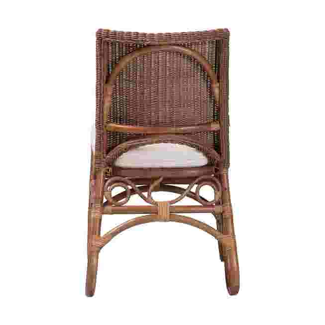 Back view of rattan dining chair with white cushion