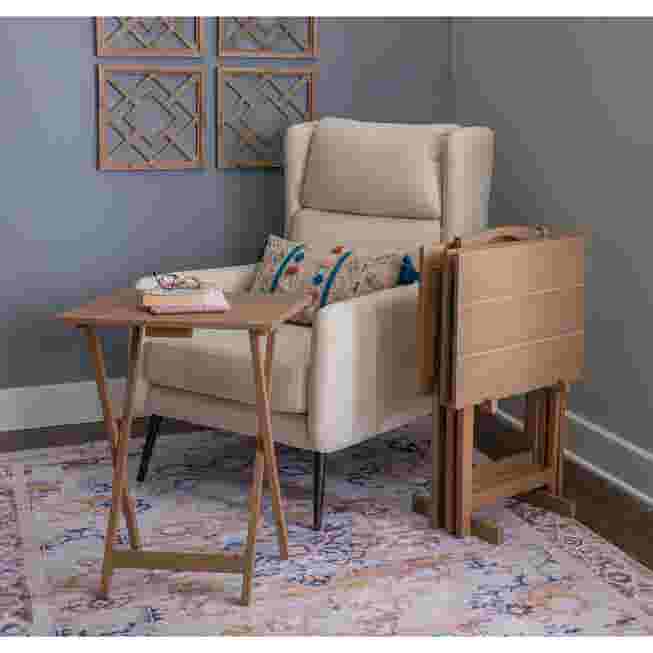 Wooden tray table in use next to an armchair