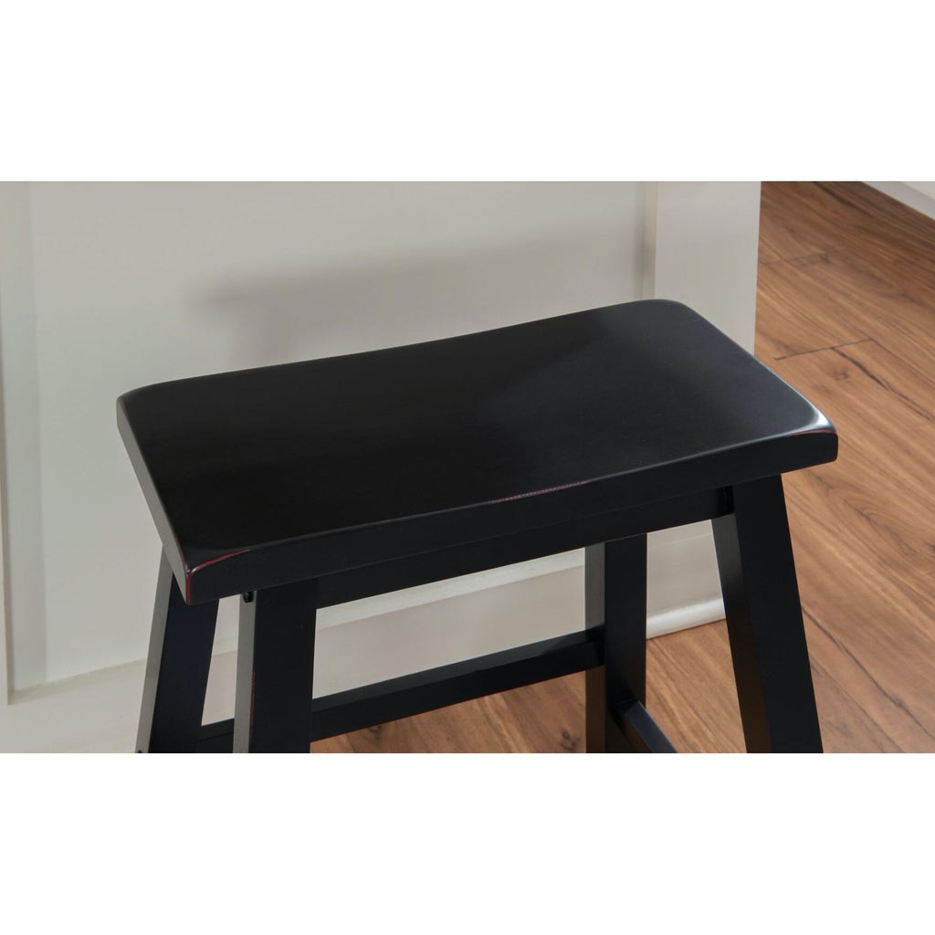 Close-up of black stool seat edge