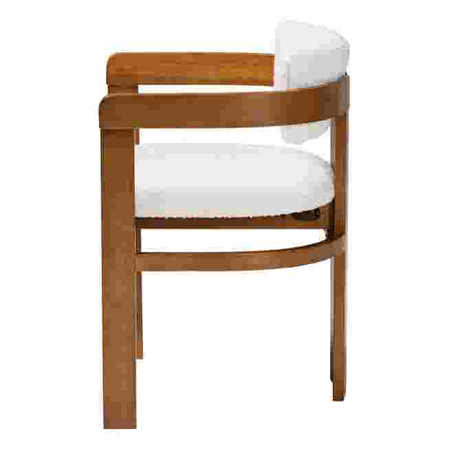 Side view of cream boucle dining chair with wooden frame