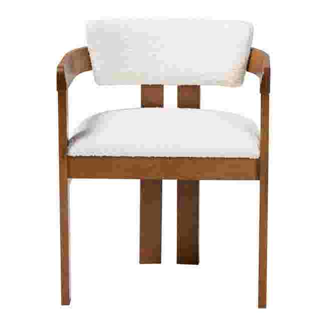 Cream boucle dining chair with wooden frame on white background