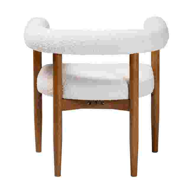 Back view of a white boucle dining chair with wooden legs