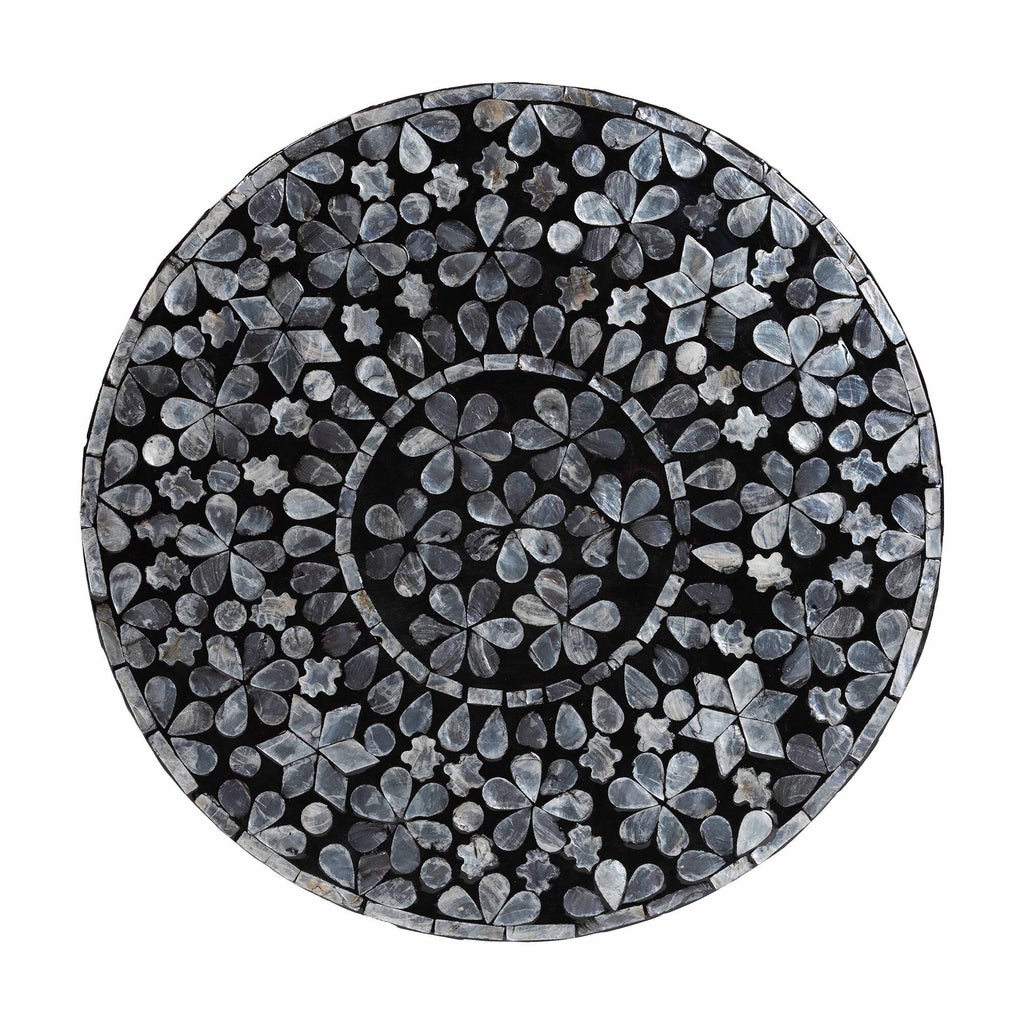 Top view of mosaic tabletop with flower/leaf inlay