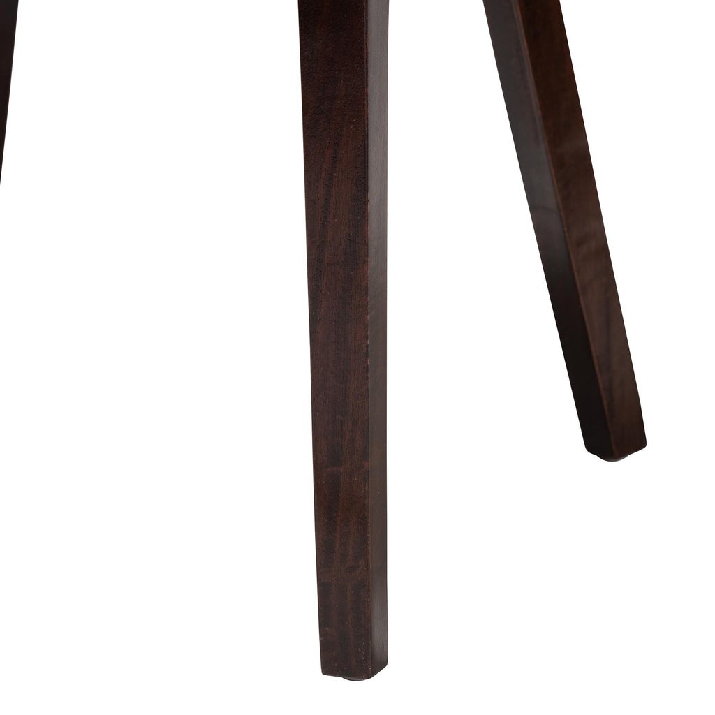 Close-up of dark brown wooden dining chair leg
