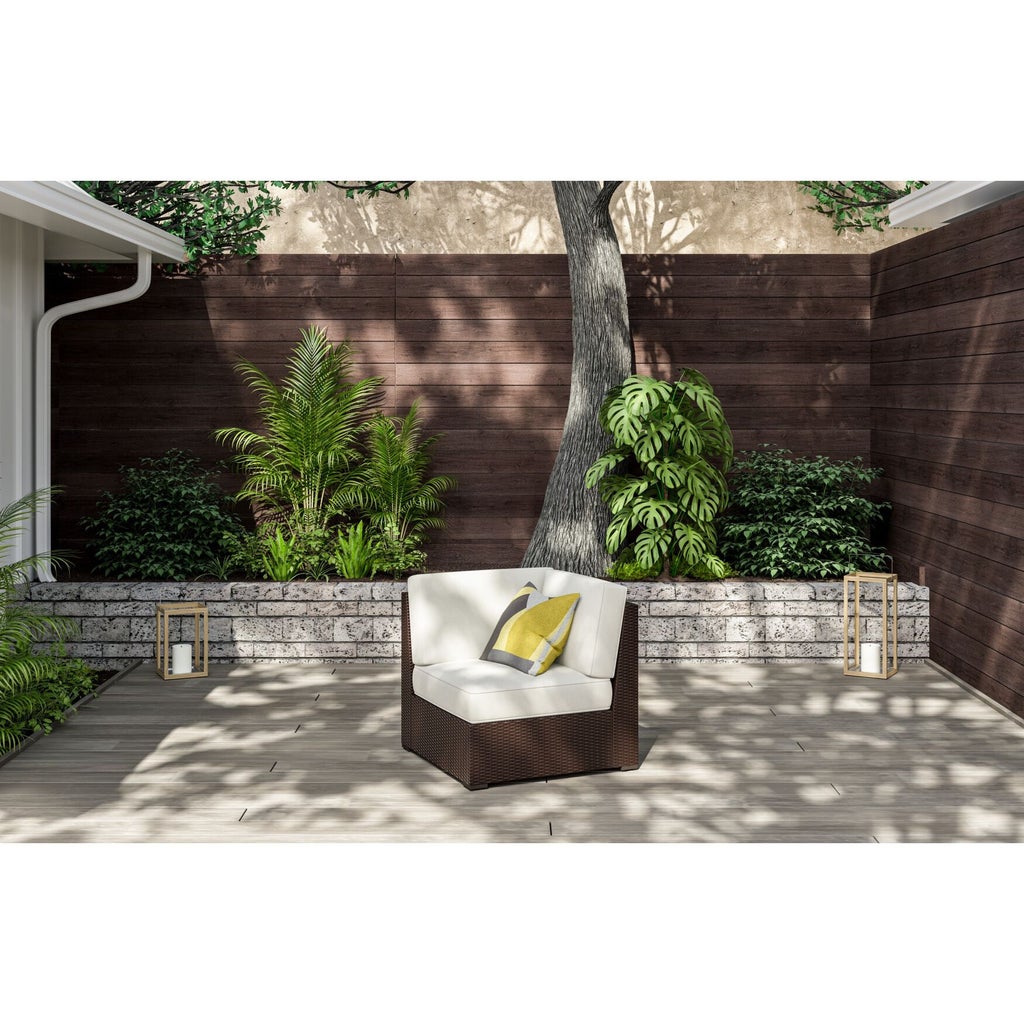Single Palm Springs chair in a garden patio with plants and decor