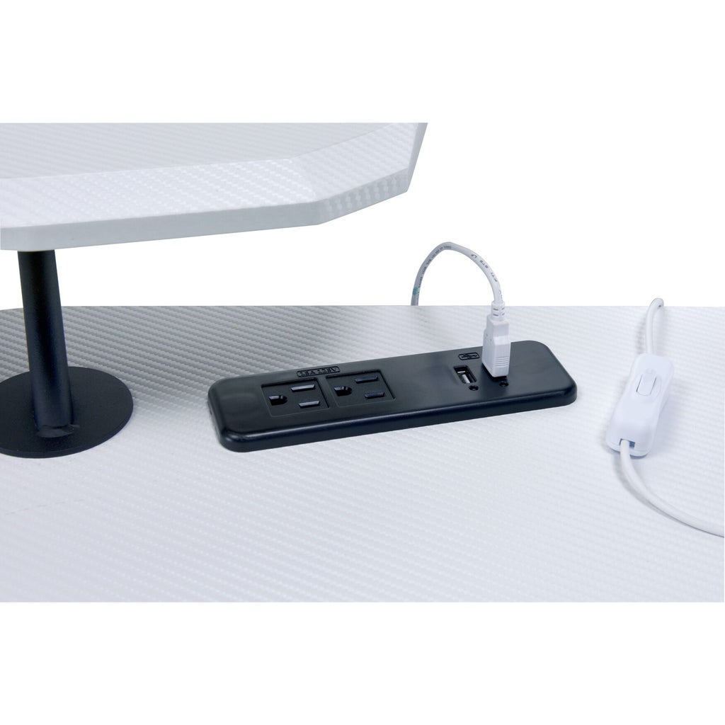 Close-up of power and USB ports on white gaming table