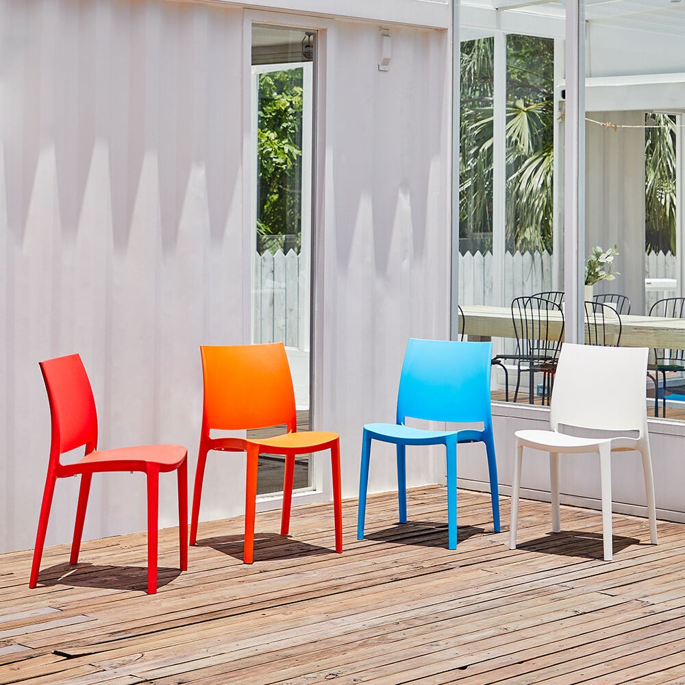 Set of colorful outdoor dining chairs on deck
