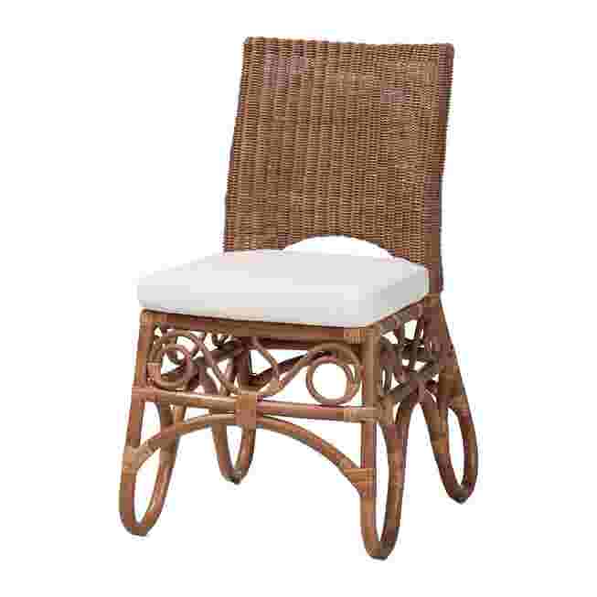 Rattan dining chair with white cushion on white background