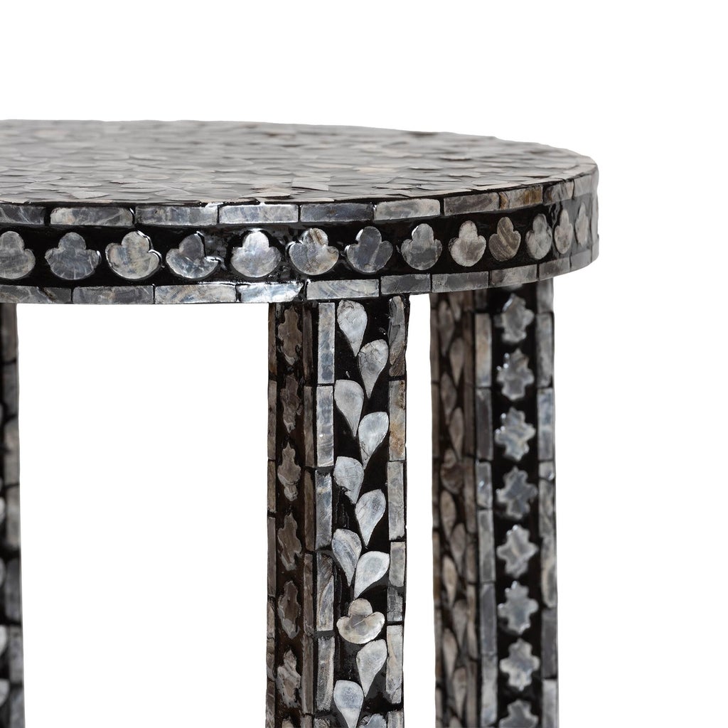 Close-up of mosaic shell inlay on table edge