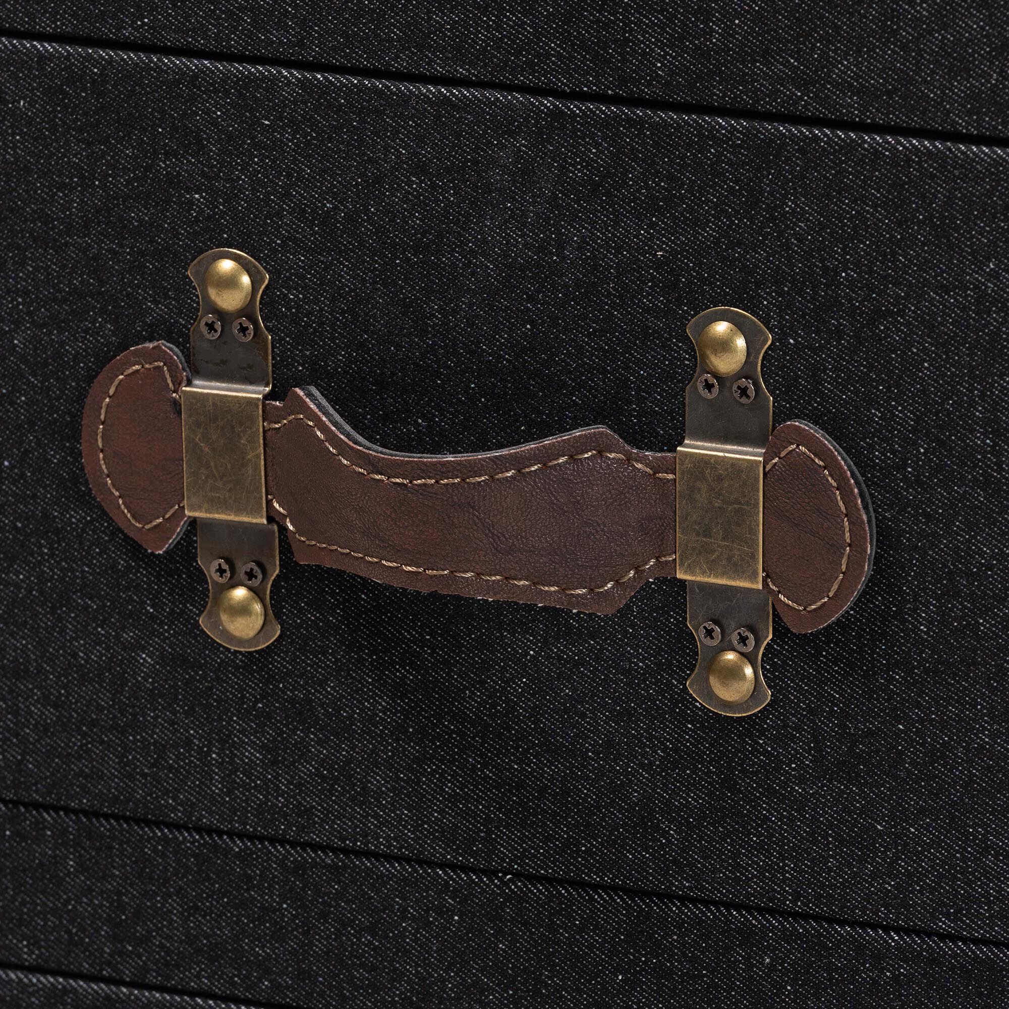 Close-up of the drawer handle on a black canvas end table