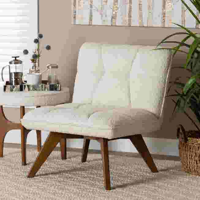 Cream boucle fabric accent chair in a living room setting