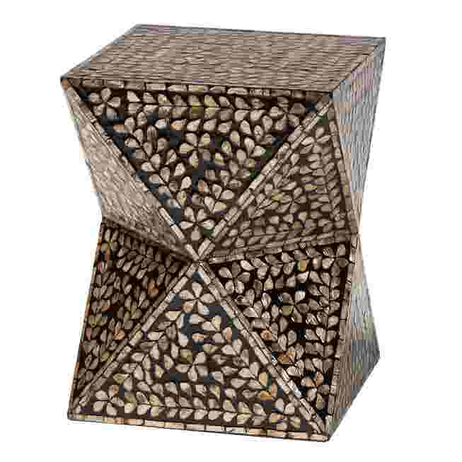 A modern bohemian end table with a black and bronze mother of pearl inlay, viewed from a three-quarter angle, highlighting its geometric twist design.