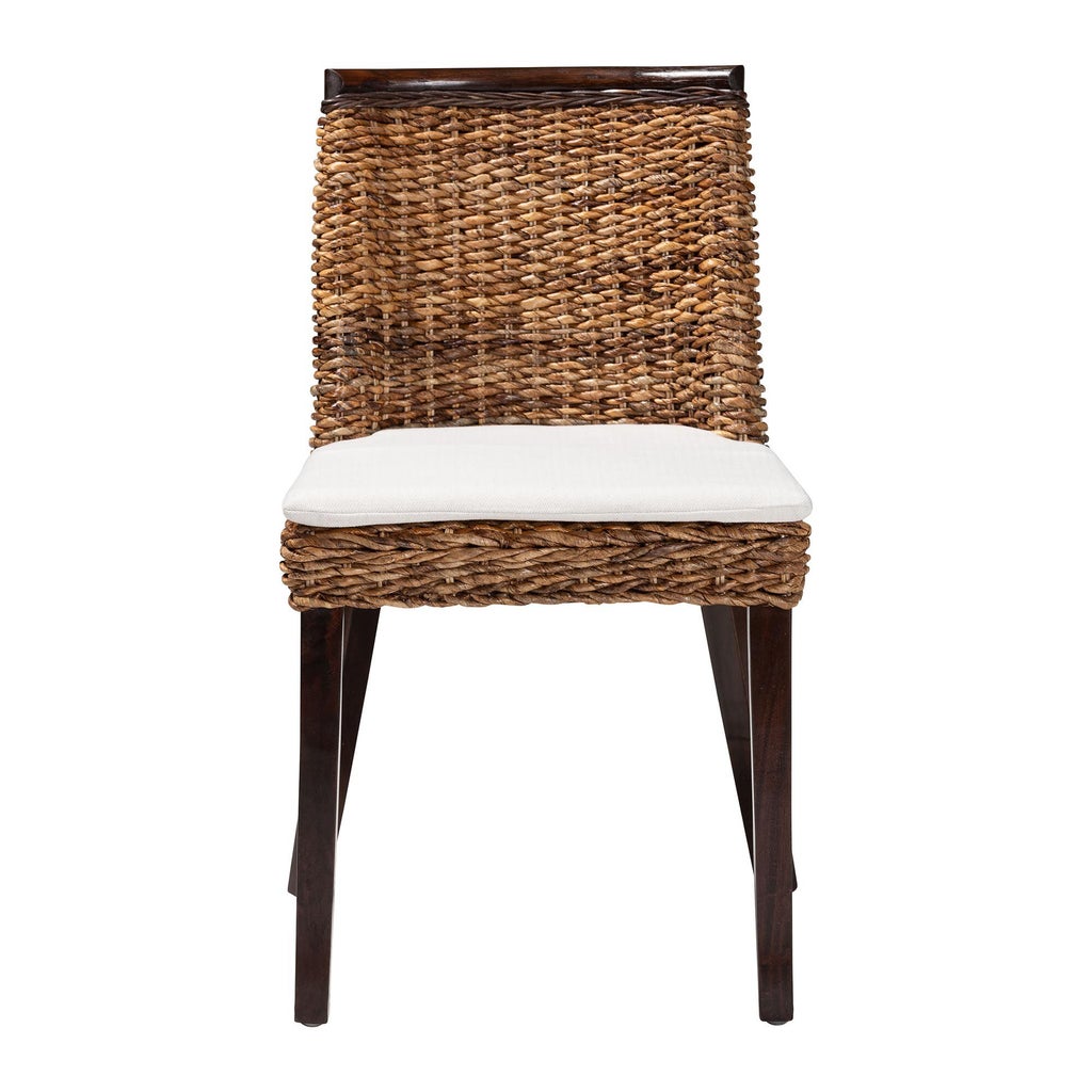 Side view of seagrass dining chair with white cushion and dark brown wood legs