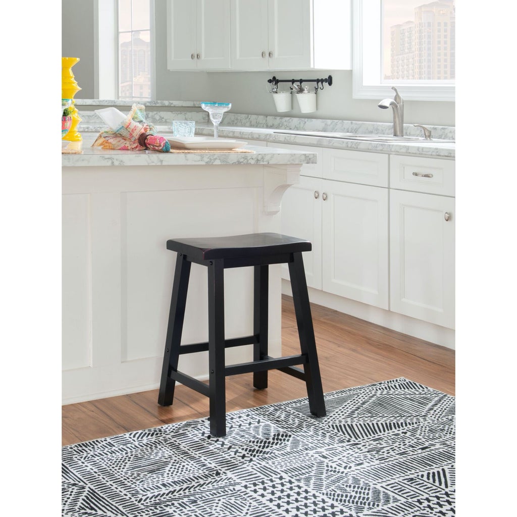 Single black stool in kitchen