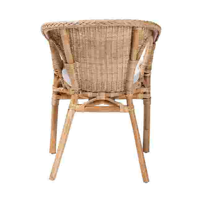 Back view of natural rattan dining chair with white cushion
