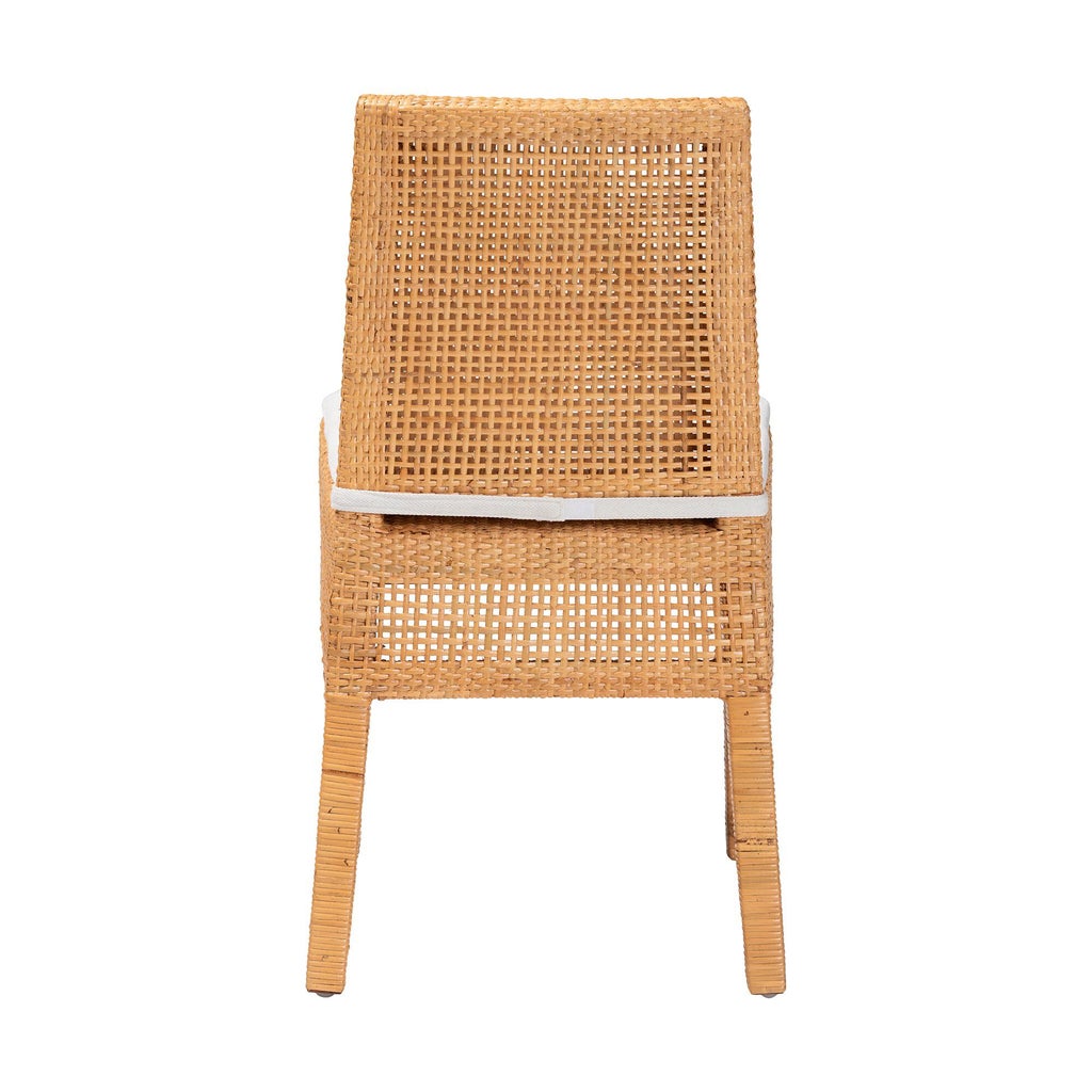 Back view of rattan dining chair with white cushion