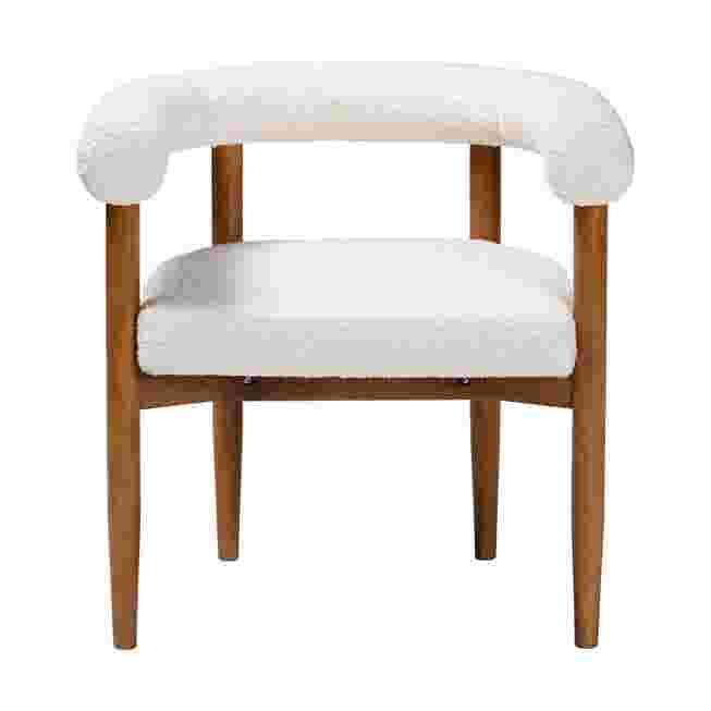 White boucle dining chair with wooden legs on a white background