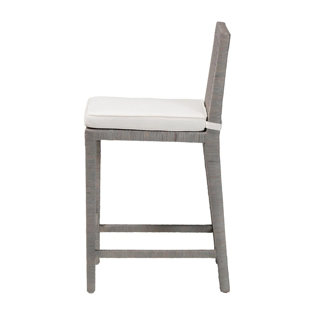 Side view of gray rattan counter stool with white cushion