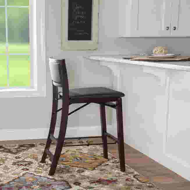 black folding bar stool in a kitchen setting