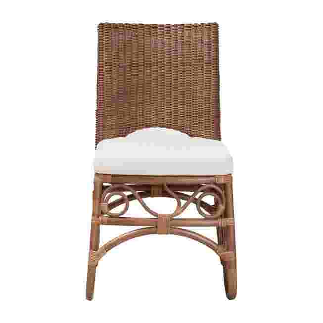 Rattan dining chair with white cushion on white background