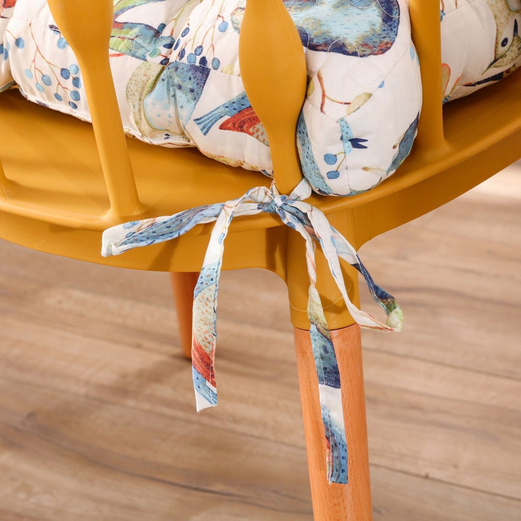 Bird-print chair pad tie on corner