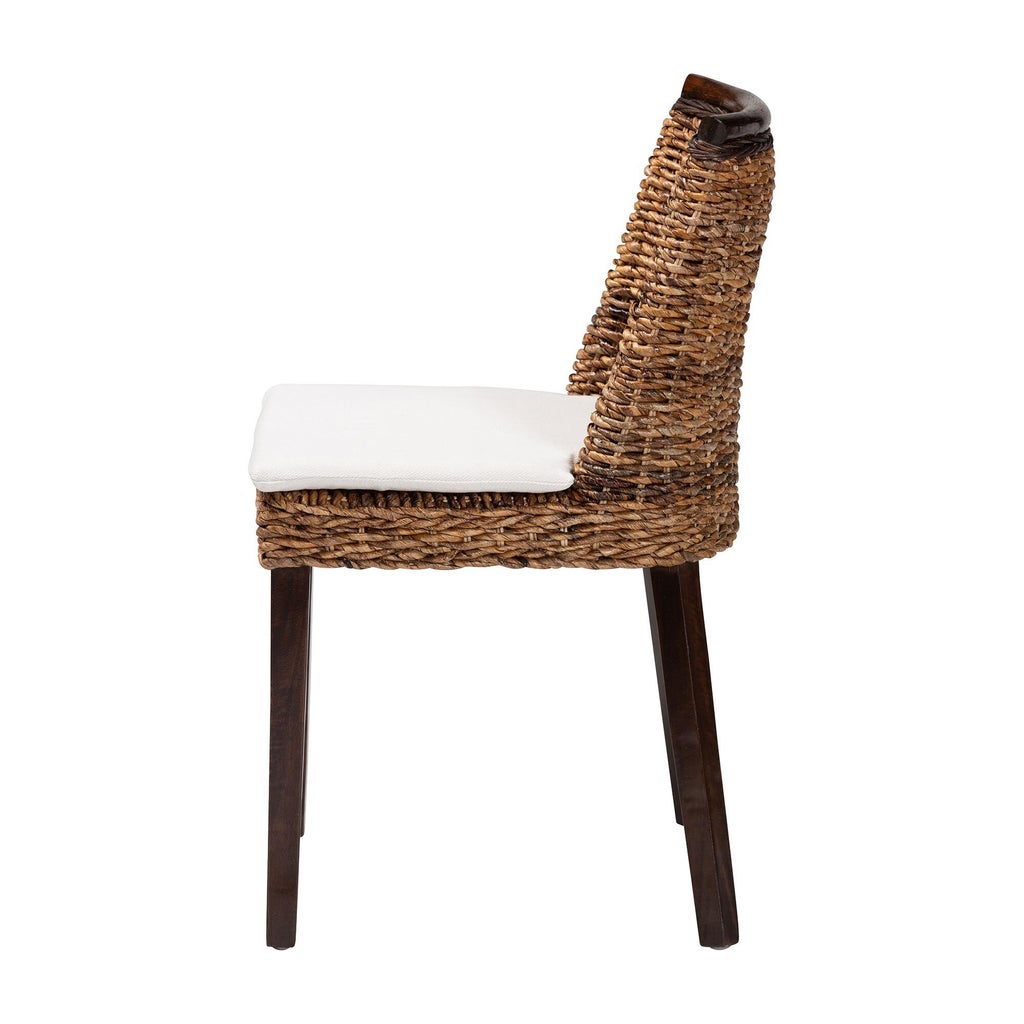 Diagonal angle of seagrass dining chair with white cushion and dark brown wood legs