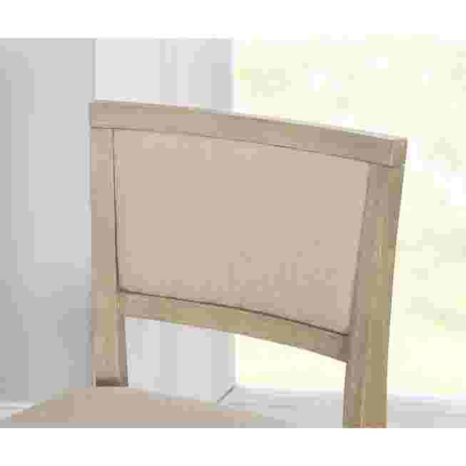 Close-up of the padded backrest of the stool