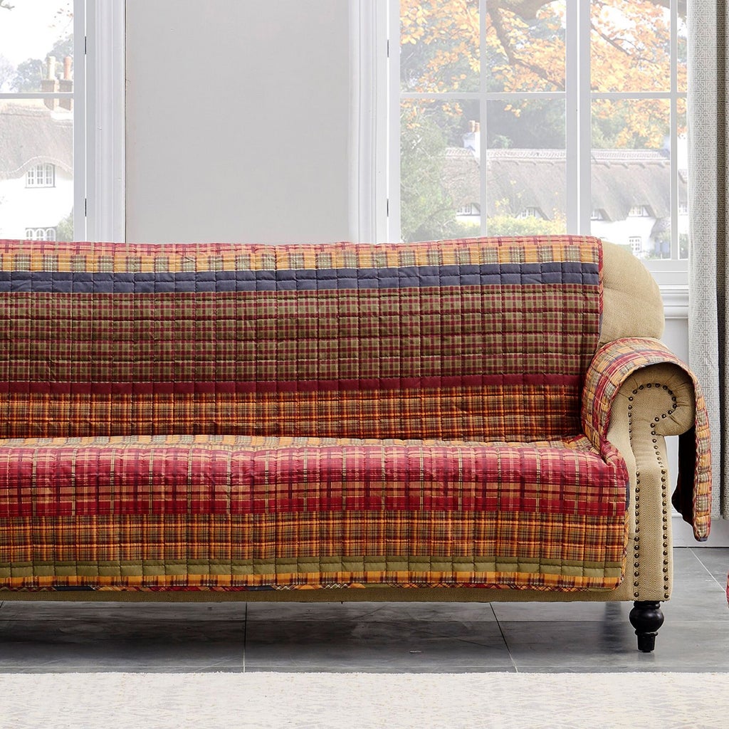 Multi-color plaid quilted furniture protector on sofa