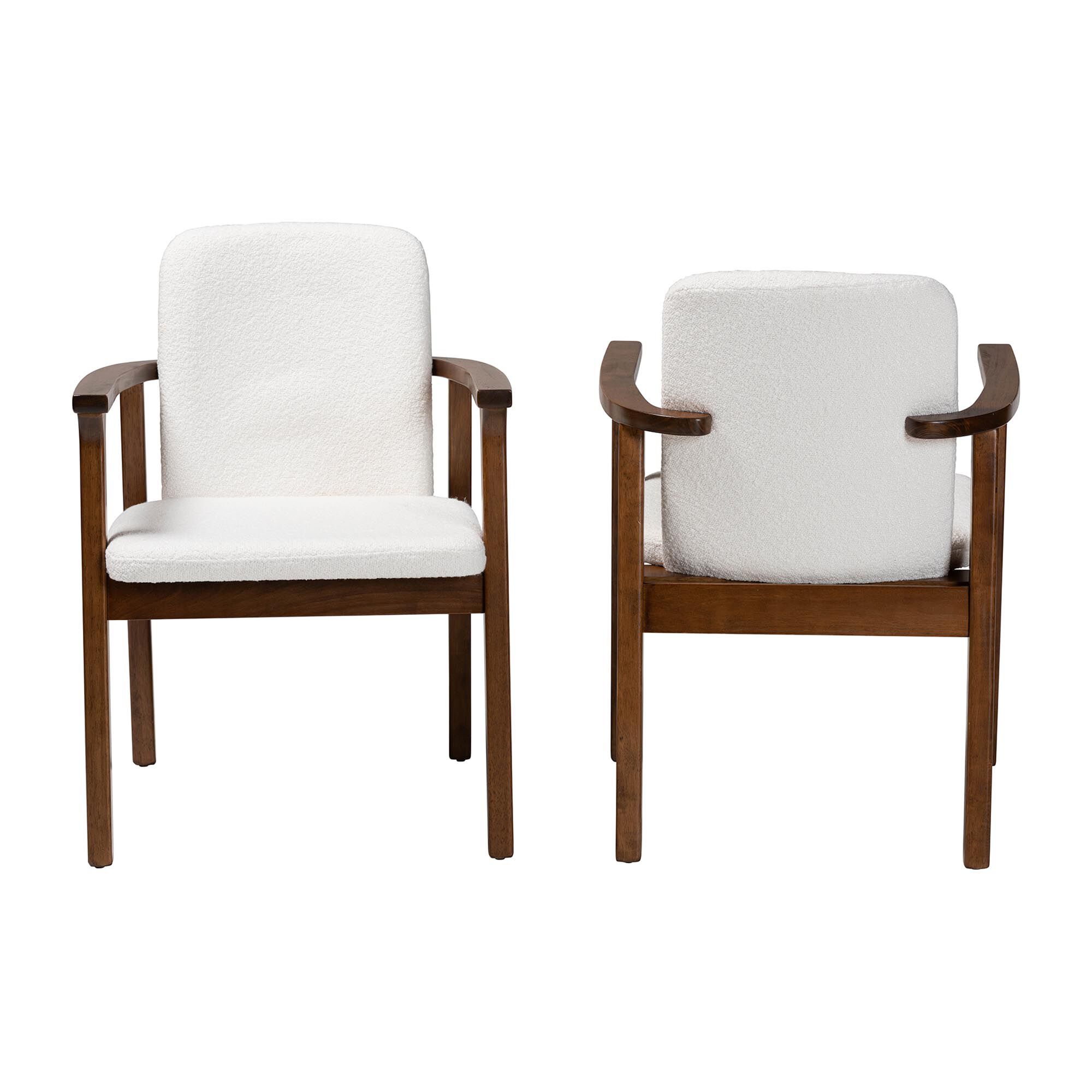 Two white upholstered armchairs with dark wood frames