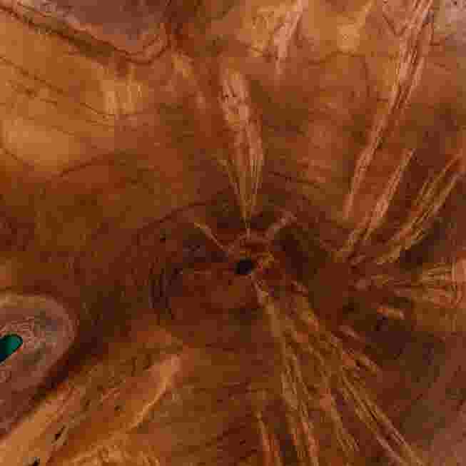 Extreme close-up of the teak wood grain and epoxy resin on the end table top