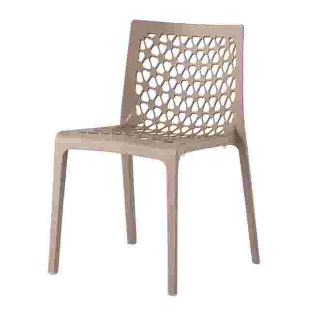 A single white outdoor dining chair with a geometric patterned backrest.