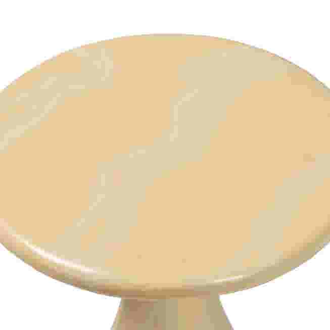 A close-up of the round top of a cream-colored resin end table.