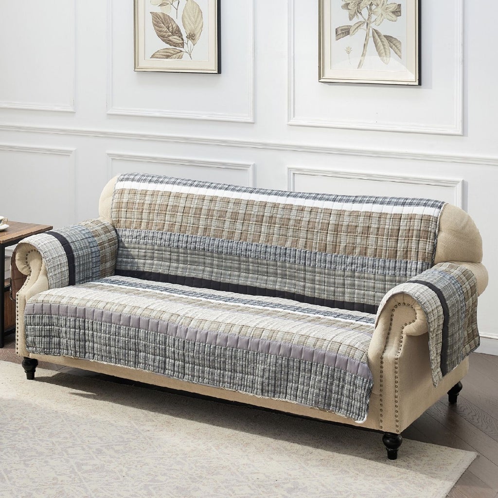 Beige/gray plaid quilted furniture protector on sofa