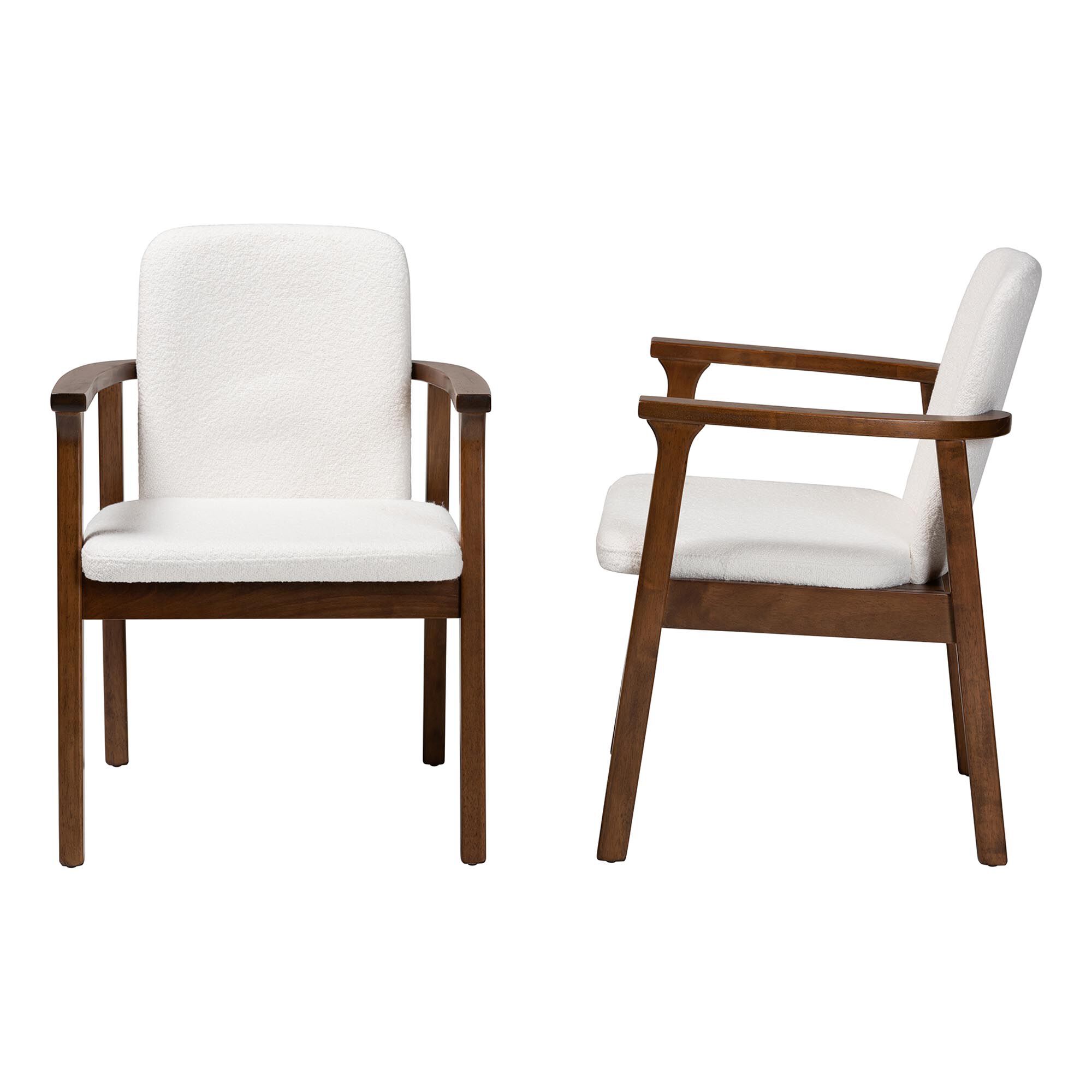 Two white upholstered armchairs with dark wood frames from different angles
