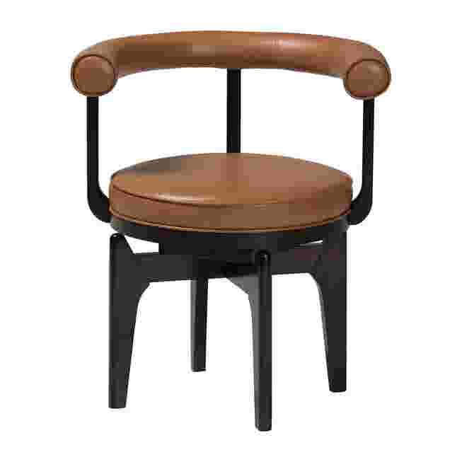 Delacruz swivel dining chair with brown leather upholstery and black frame.