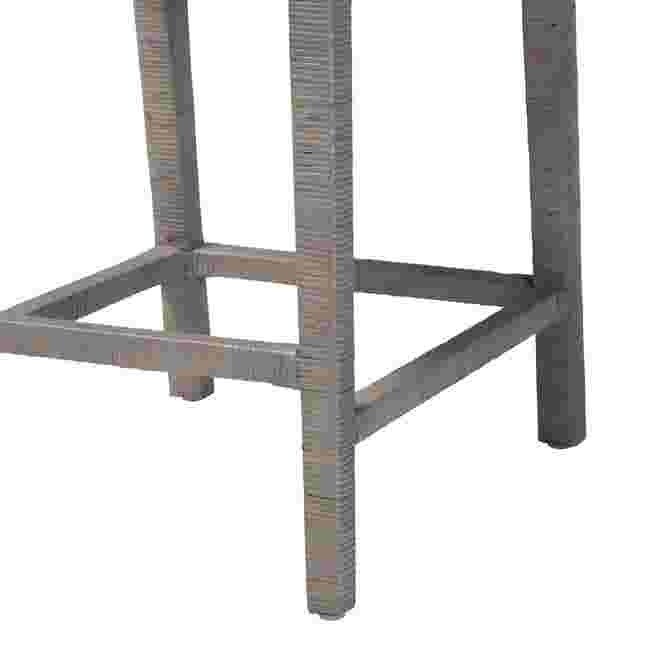 Close-up of the metal frame and leg of the Sofia Natural Rattan Counter Stool