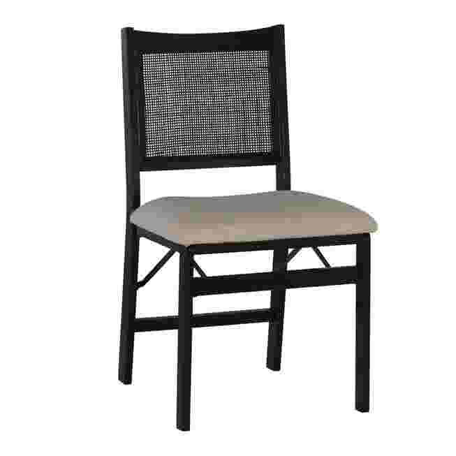 Black folding chair with a woven back and a light-colored seat cushion.