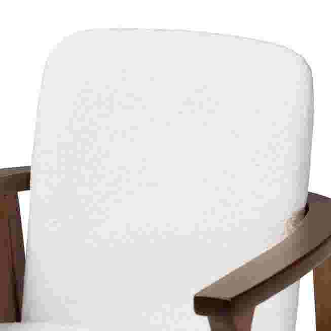 Close-up of the white upholstered backrest of an armchair