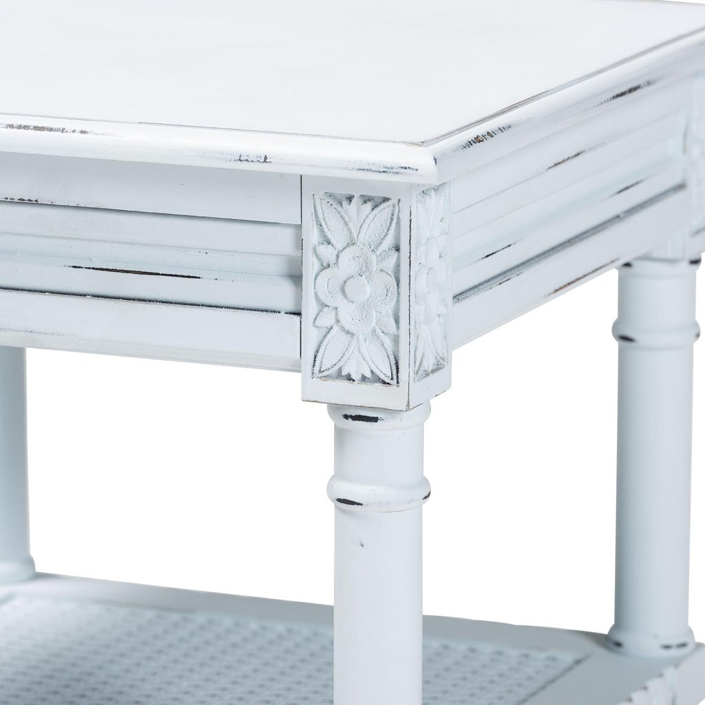 Close-up of carved leg block on the end table