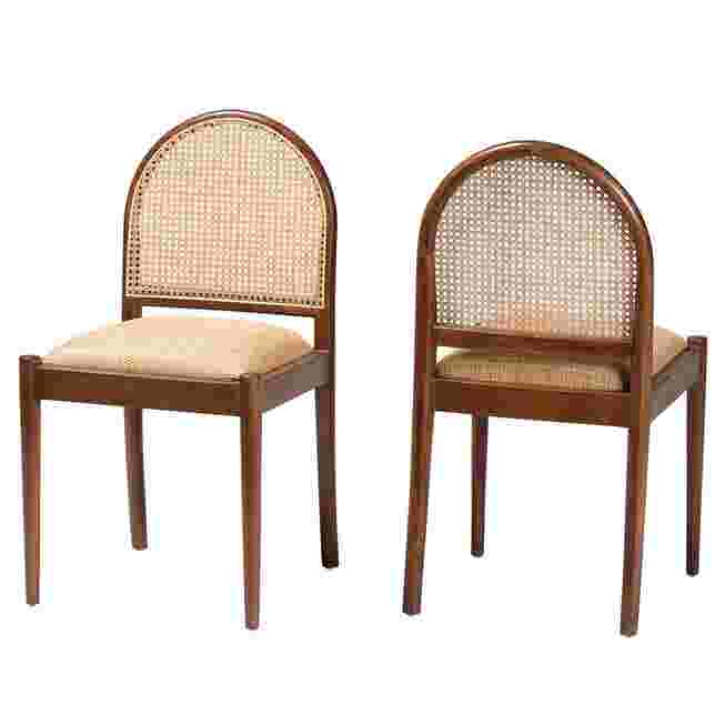 Two dining chairs with natural rattan backs and wooden frames.