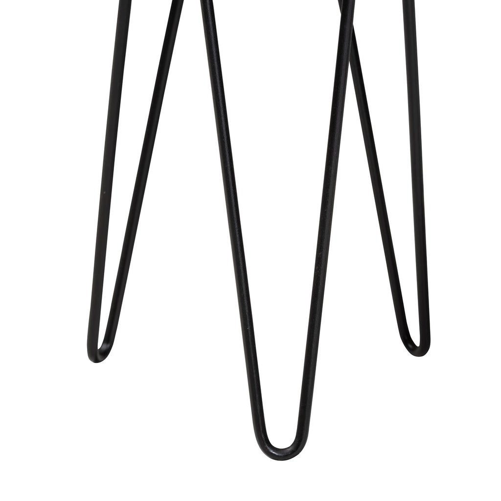 Close-up of the table legs (black metal) long slim legs