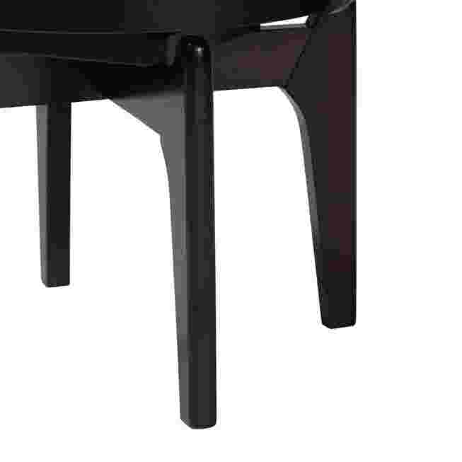Close-up of the black legs of the Delacruz swivel dining chair.